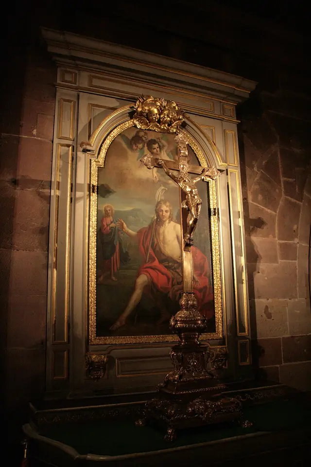 Baroque crucifix and baroque painting inside a chapel of Notre-Dame de Strasbourg