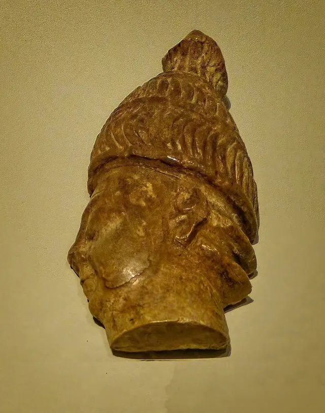 Head of a warrior wearing boar tusk helmet carved of hippopotamus ivory from Phylaki, 1375-1300 BCE, Archaeological Museum of Chania (Crete)
