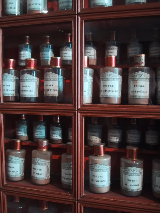 Bottles on shelves at the apothecary at the Hospices de Beaune